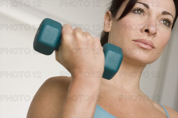 Woman lifting weights.