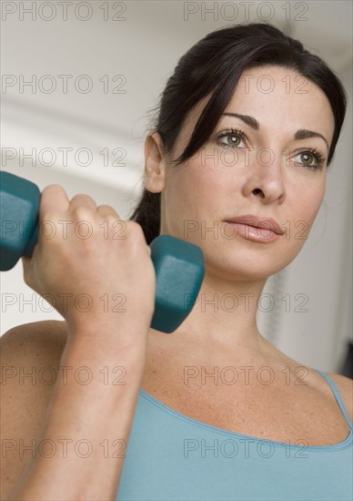 Woman lifting weights.