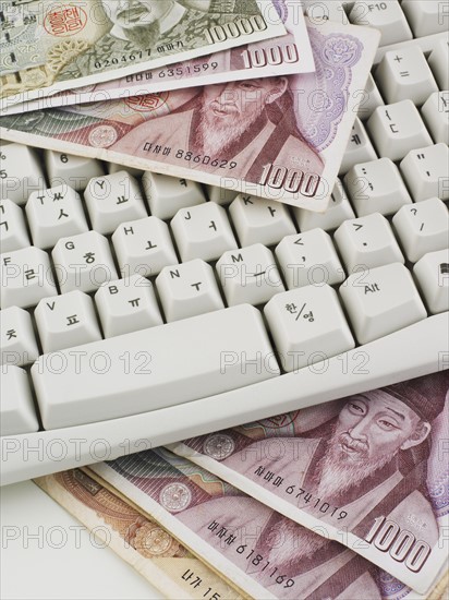 Still life of keyboard and Korean money Won.