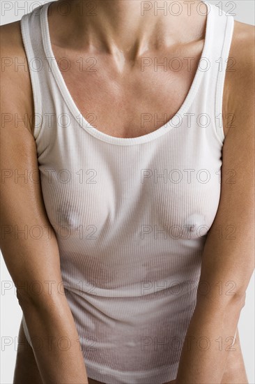 Woman wearing wet t-shirt.