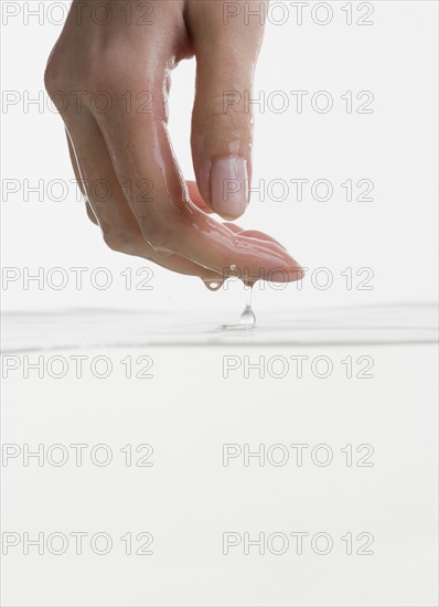 Hand touching water.