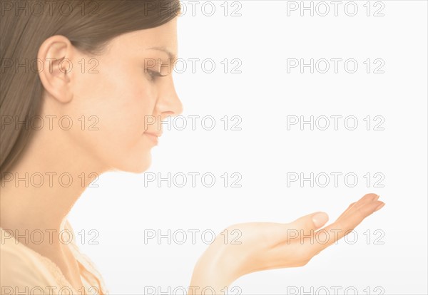 Woman holding up her hand.