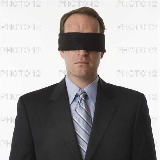 Man wearing blindfold.