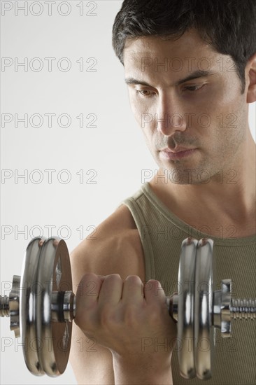 Man using free weights.