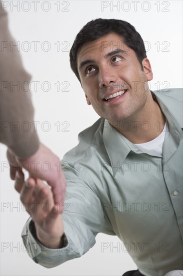 Two men shaking hands.