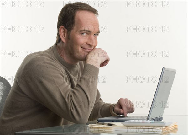 Portrait of a man at his computer.