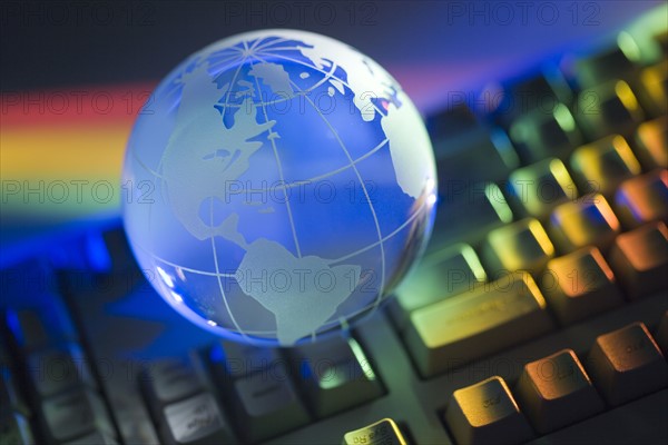 Closeup of globe and keyboard.