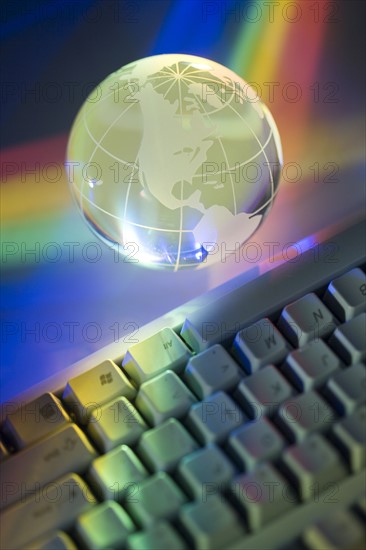 Closeup of globe and keyboard.