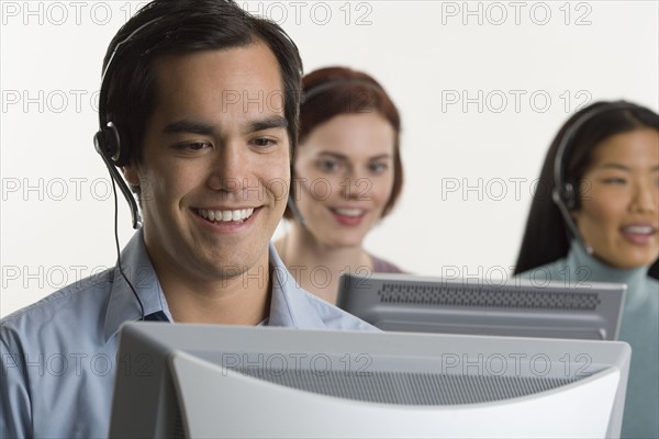 Phone operators using headsets.