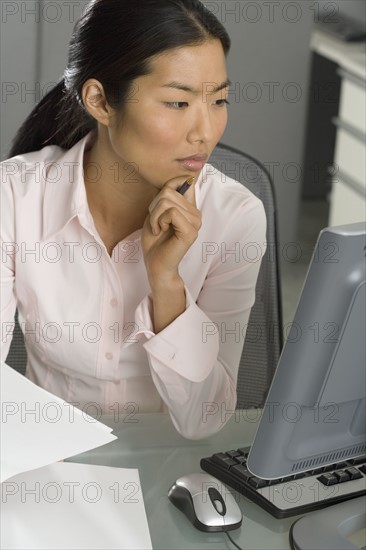 Businesswoman working at computer.