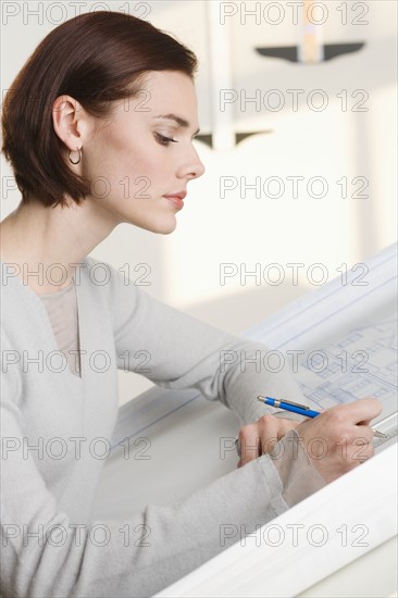 Woman at drawing board.