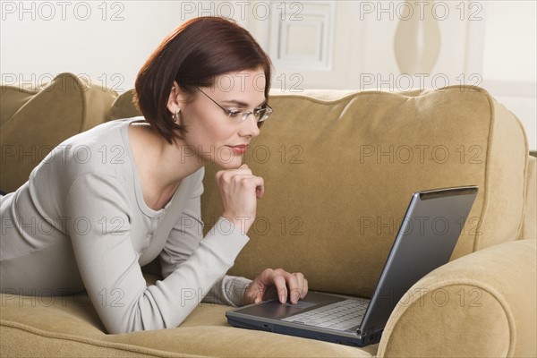 Woman at home using computer.