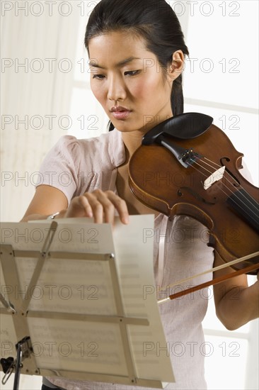 Woman playing the violin.