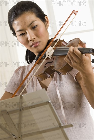 Woman playing violin.