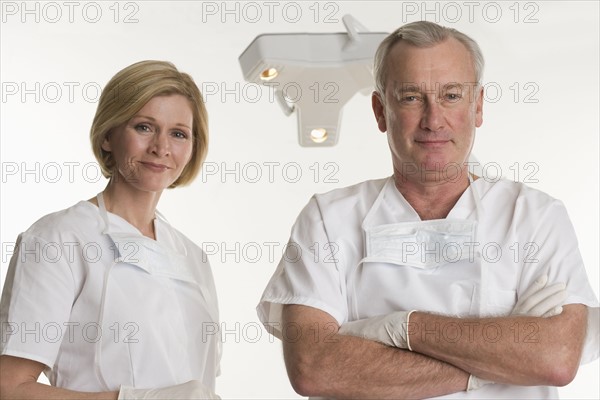 Portrait of dentist with dental hygienist.