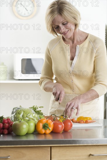 Woman cutting vegetables.