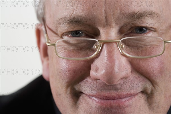 Portrait of man with glasses.