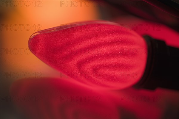 Closeup of a glowing Christmas light bulb.