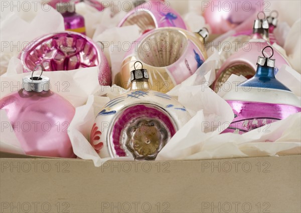 A box of Christmas ornanaments.