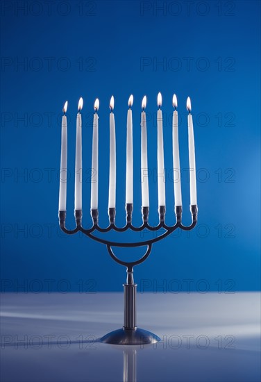 A fully lit menorah.