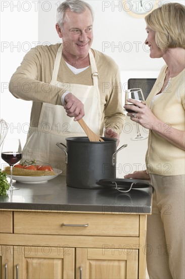 Wife and husband cooking.