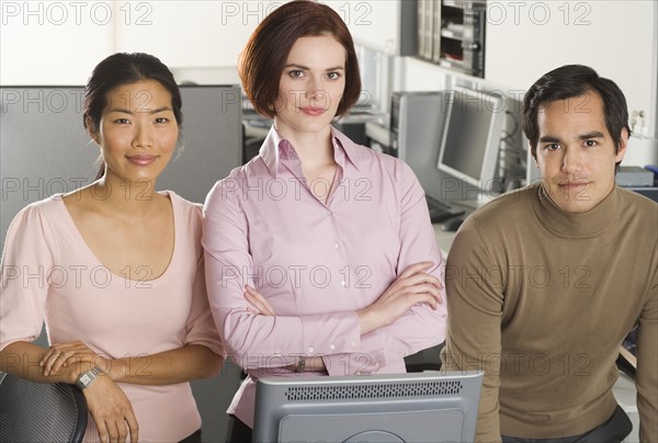 Portrait of three office workers.