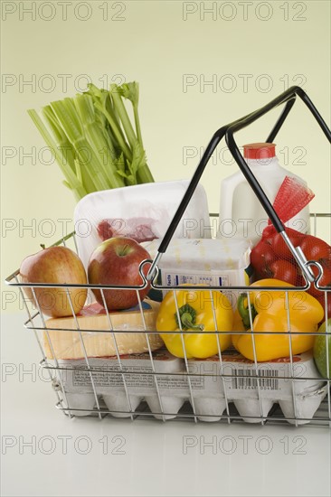 Still life of groceries in basket.