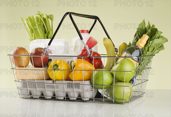 Still life of groceries in basket.