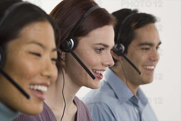 Phone operators using headsets.