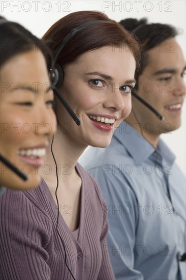 Phone operators using headsets.