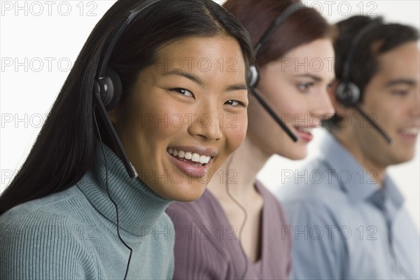 Phone operators using headsets.