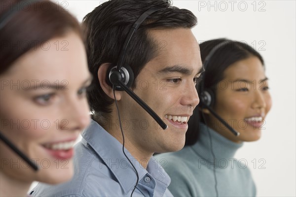 Phone operators using headsets.