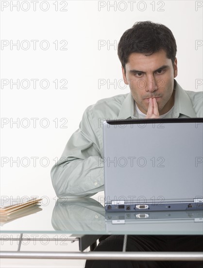 Man working at a computer.