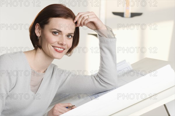 Portrait of woman at drawing board.