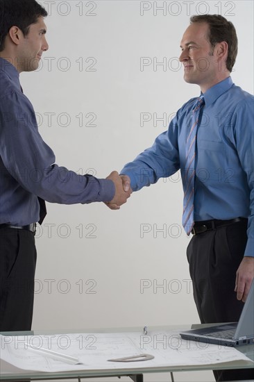 Two men shaking hands.