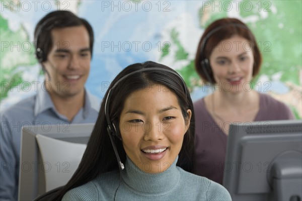 Phone operators using headsets.