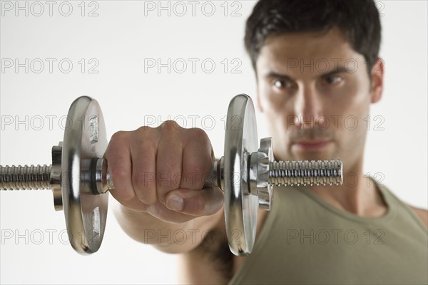 Man using free weights.