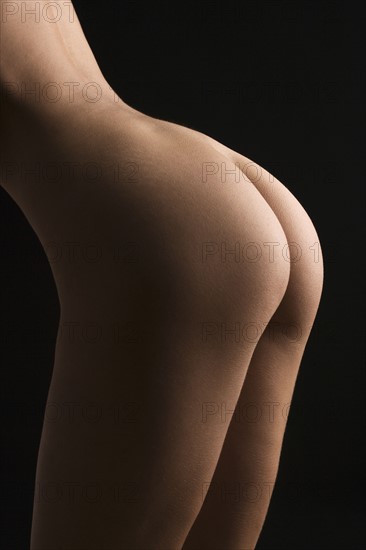 Rear view of nude female.