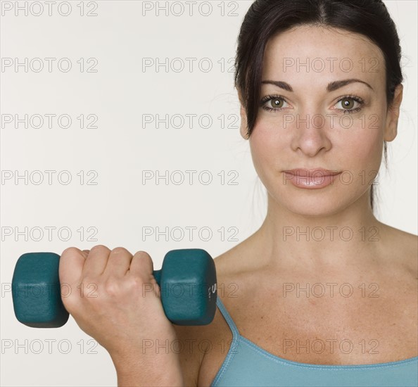 Woman lifting weights.