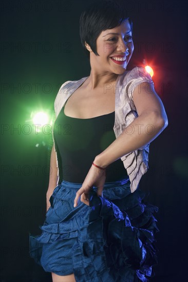 Woman dancing at nightclub.