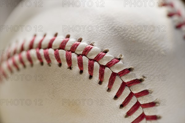 Closeup of stitching on a baseball.