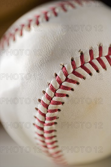 Closeup of stitching on a baseball.