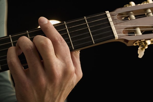 Man playing guitar.