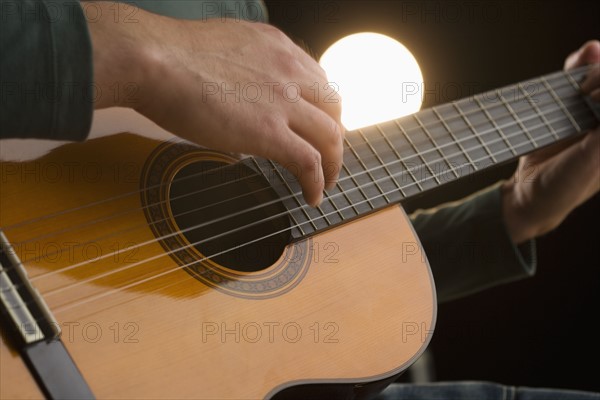 Man playing guitar.