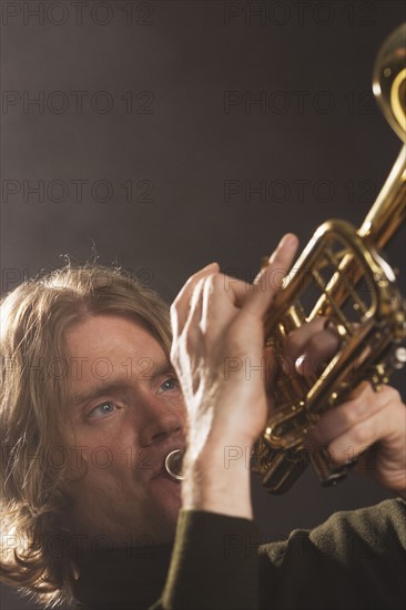 Man playing horn.