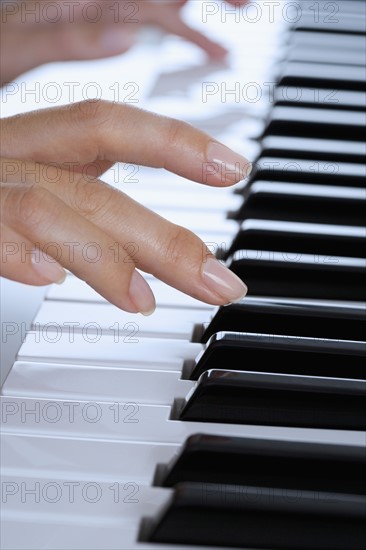 Fingers playing piano.