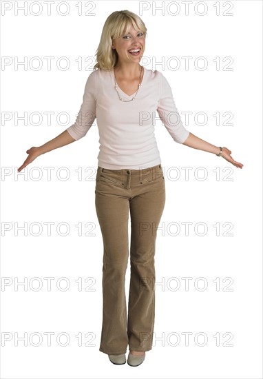 Woman gesturing with arms outstretched.