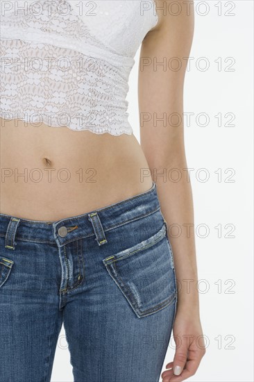 Closeup of woman's midriff.