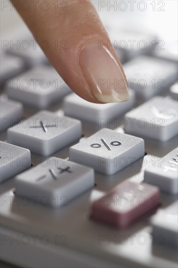 Woman using a calculator.