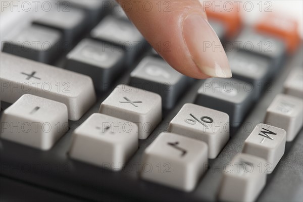 Woman using a calculator.